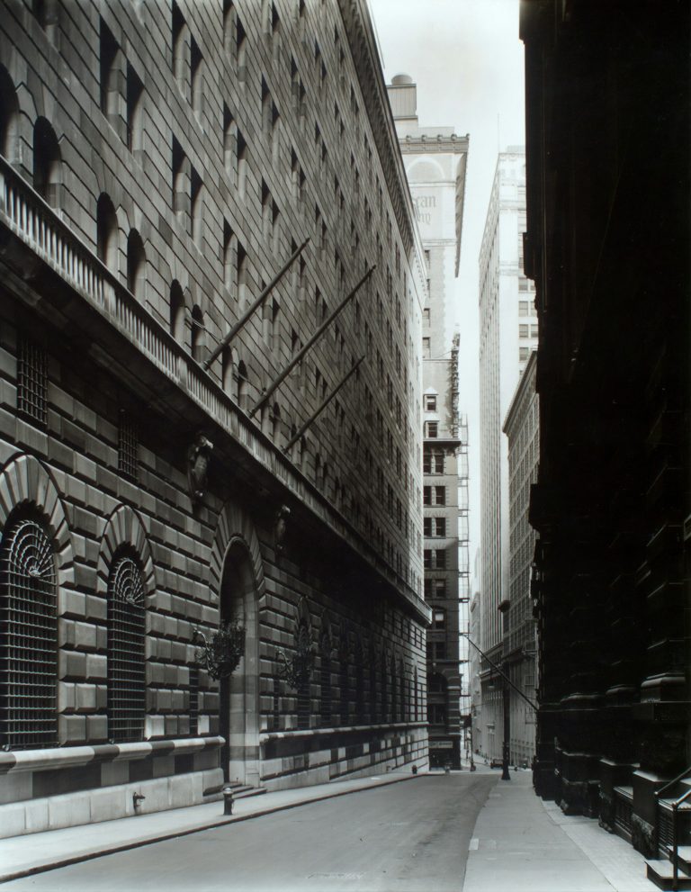 A narrow street running between tall stone buildings