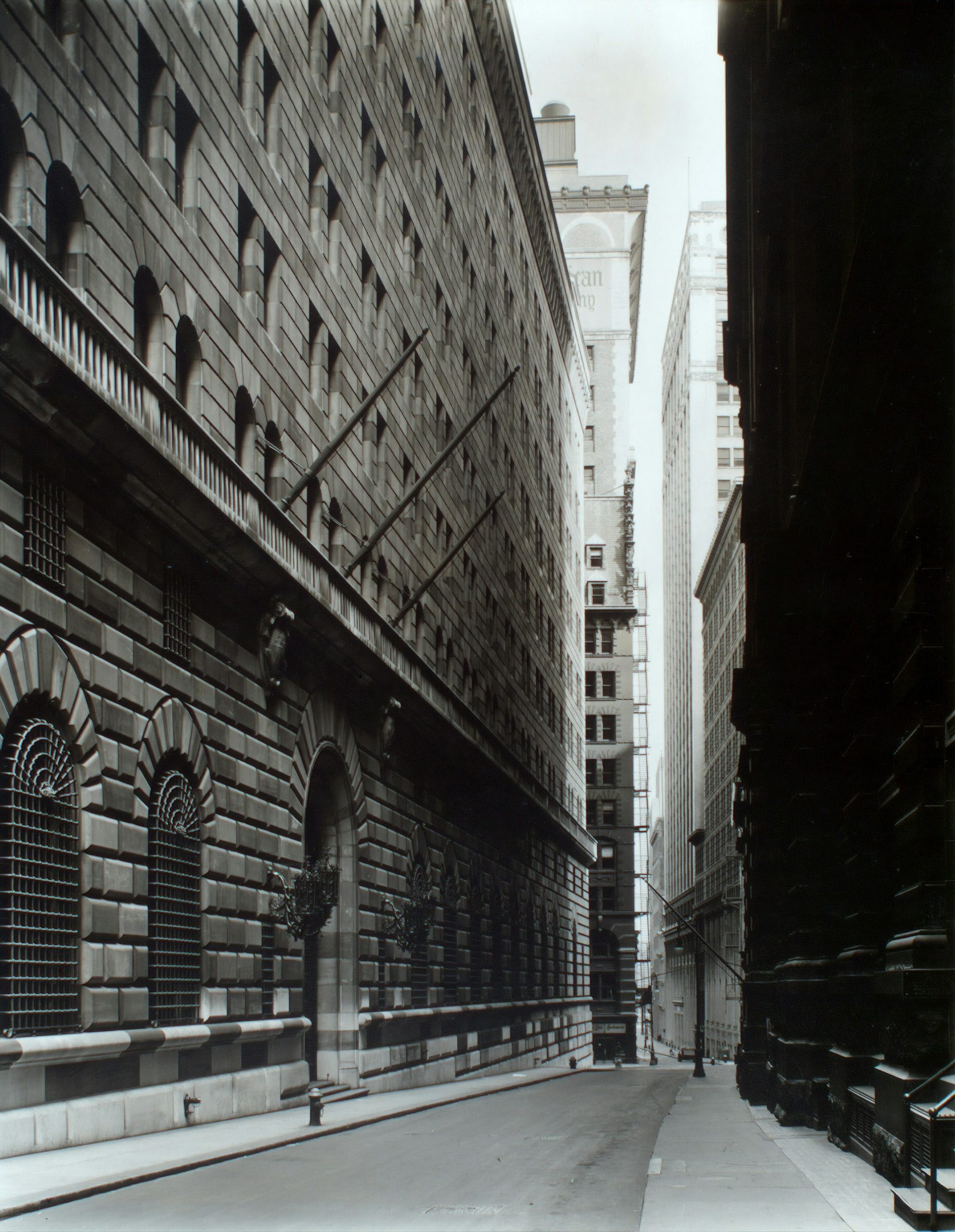 A narrow street running between tall stone buildings